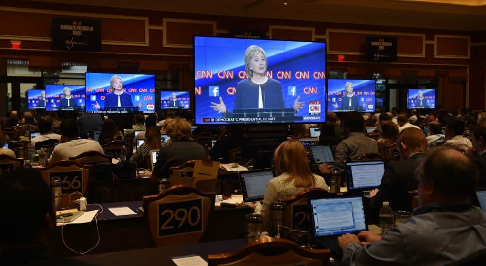 Members of the media work as Hillary Clinton speaks during the CNN Democratic presidential debate Tuesday, Oct. 13, 2015, in Las Vegas. (David Becker/AP)