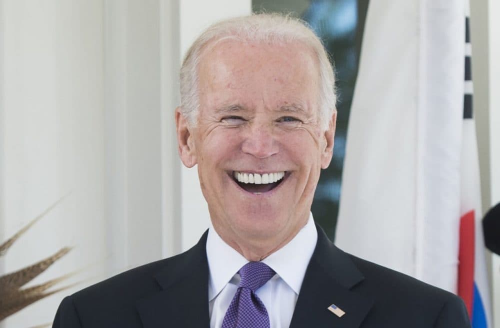 U.S. Vice President Joe Biden laughs during the arrival of the South Korean President for lunch at the Naval Observatory in Washington, D.C., October 15, 2015. (Saul Loeb/AFP/Getty Images)