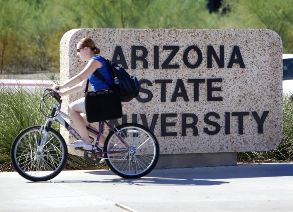 A student rides through the Arizona State University campus Thursday, Sept. 23, 2010 in Tempe, Ariz. (Matt York/AP)