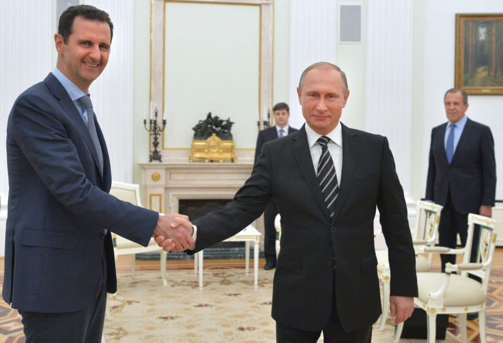 Russian President Vladimir Putin (right) shakes hands with his Syrian counterpart Bashar Assad (left) during a meeting at the Kremlin in Moscow on October 20, 2015. Assad, on his first foreign visit since Syria's war broke out, told his main backer and counterpart Putin in Moscow that Russia's campaign in Syria has helped contain &quot;terrorism.&quot; (Alexey Druzhnin/AFP/Getty Images)