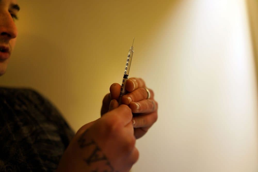 Drugs are prepared to shoot intravenously by a user addicted to heroin on February 6, 2014 in St. Johnsbury Vermont. (Spencer Platt/Getty Images)