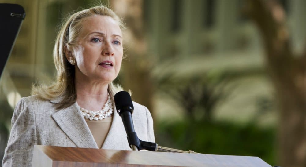As secretary of state, Clinton hailed the Trans-Pacific Partnership as “the gold standard in trade agreements.” By now demanding its defeat, Rich Barlow says she is playing politics. In the Nov. 10, 2011 speech at the University of Hawaii, pictured here, Clinton said, &quot;The TPP will bring together economies from across the Pacific, developed and developing alike, into a single 21st century trading community.&quot; (Marco Garcia/ AP file)