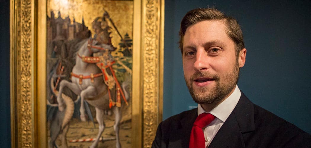 Curator Nat Silver stands in front of Carlo Crivelli's iconic &quot;Saint George Slaying the Dragon,&quot; at the Isabella Stewart Gardner Museum. (Jesse Costa/WBUR)