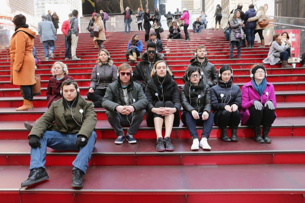 NYC commuters during a Meditation Moment in Times Square in celebration of the Westin Well-being Movement (partnered with Headspace) launch on March 20, 2014 in New York City.  (Neilson Barnard/Getty Images for Westin Hotels &amp; Resorts)