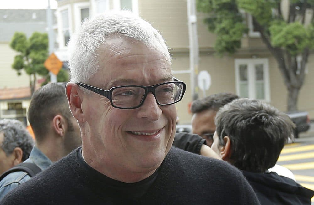 Activist Cleve Jones smiles outside of a U.S. Post Office as customers buy commemorative stamps honoring Harvey Milk, the California politician and gay rights icon, at a U.S. Post Office in San Francisco, Thursday, May 22, 2014. (Jeff Chiu/AP)