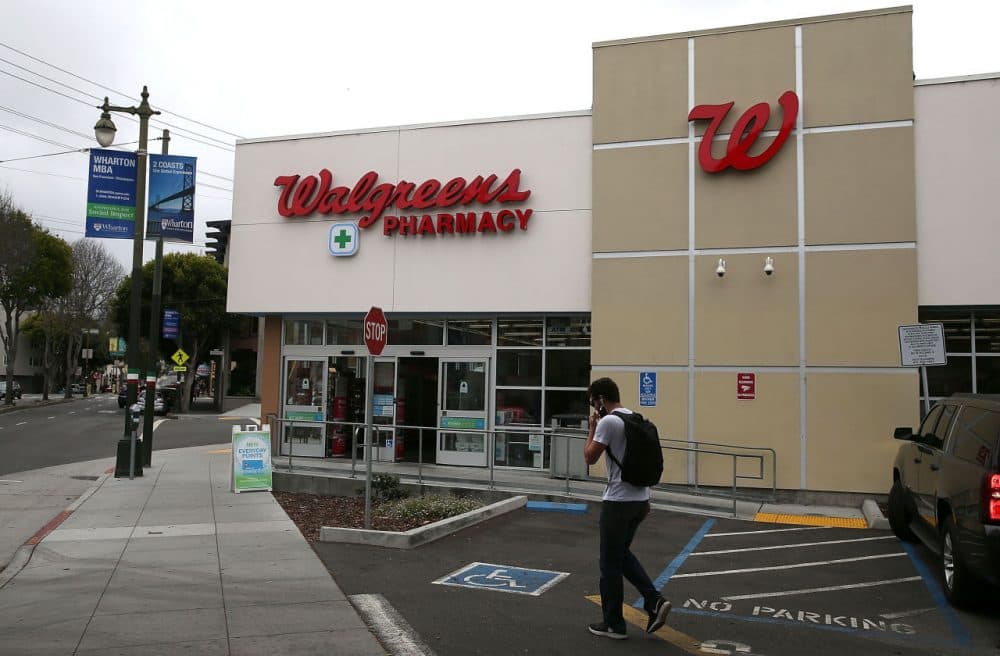 A pedestrian walks by a Walgreens store on July 9, 2015 in San Francisco, California. (Justin Sullivan/Getty Images)