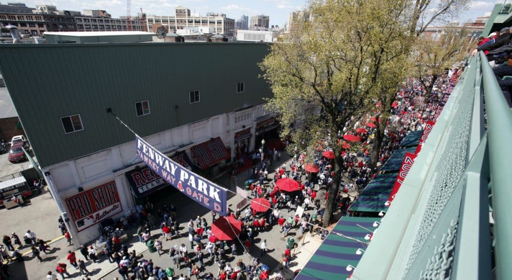 Tom Keane: The state inspector general is right. The BRA's 2013 land deal with the Red Sox could have been handled better. But the result still would have been the same. In this photo, fans walk on Yawkey Way outside Fenway Park before a baseball game between the Boston Red Sox and the Tampa Bay Rays in Boston, Friday, April 13, 2012. (Michael Dwyer/ AP)