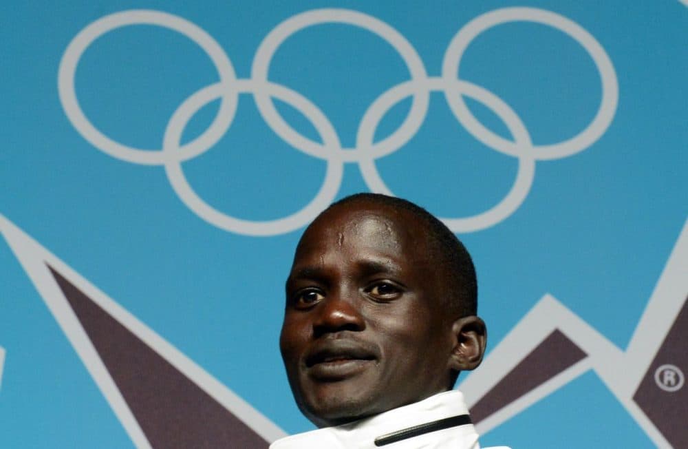 A stateless athlete Guor Marial, from South Sudan, poses at a press conference at the London Olympics media center during the London 2012 Olympic Games on August 10, 2012 in London. Marathon runner Marial, who was displaced by the war in Sudan, competes in London 2012 Olympic Games as an independent Olympics athlete. (Saeed Khan/AFP/Getty Images)