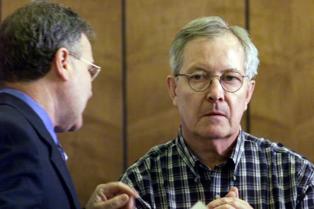 Retired priest Rev. Ronald Paquin, right, talks with his attorney in a 2002 file photo. (Tom Landers/AP)