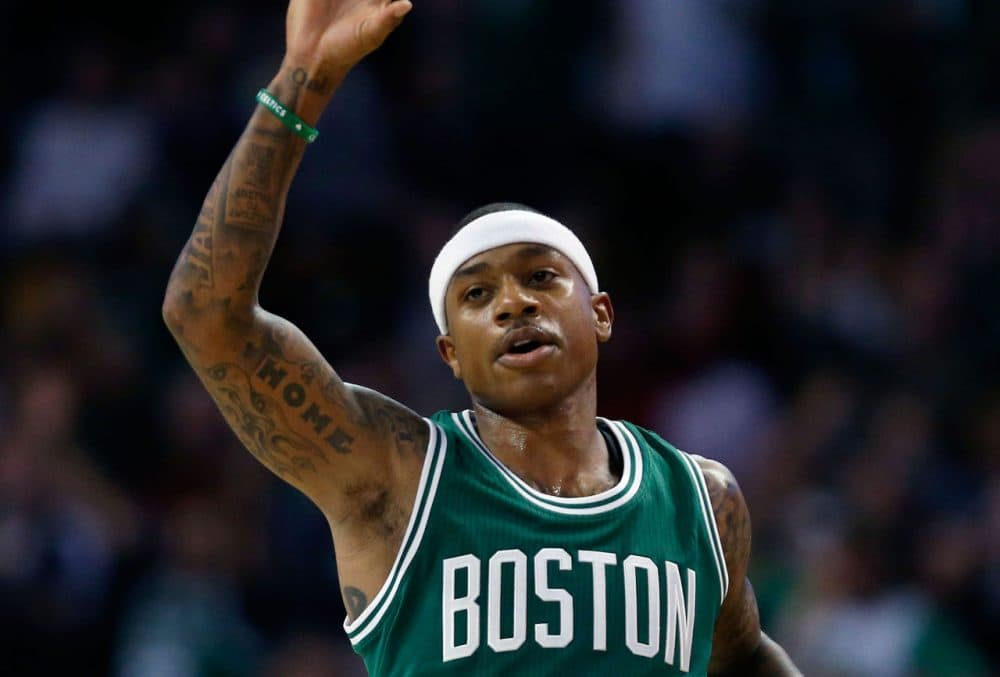 Boston Celtics' Isaiah Thomas celebrates after making a 3-pointer in the season opener Wednesday. (Michael Dwyer/AP)