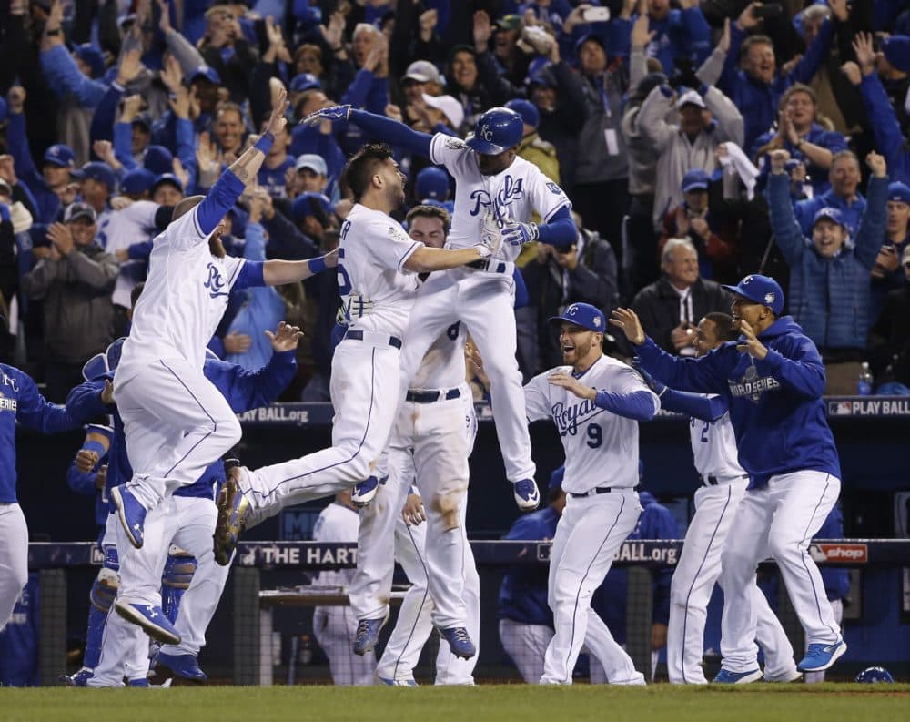 Kansas City Royals celebrate after winning the first game in the 2015 World Series in the 14th inning, concluding longest Game 1 in World Series history. (AP Photo/Matt Slocum)