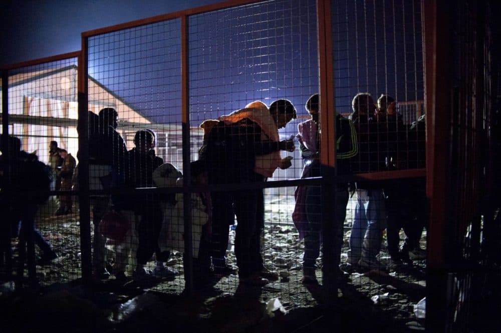 Migrants and refugees prepare to board a train heading to Serbia from the Greece-Macedonia border near Gevgelija on October 31, 2015. (Nikolay Doychinov/ AFP/Getty Images)
