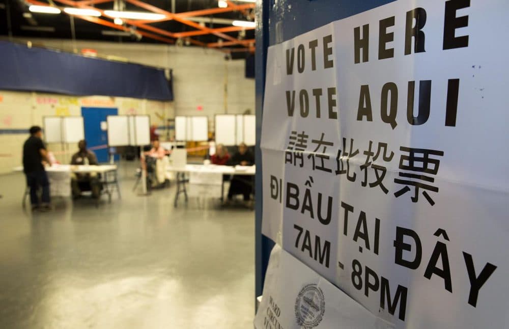 A “Vote Here” sign is seen at the Jackson/Mann School in Boston's Allston on Tuesday. (Robin Lubbock/WBUR)