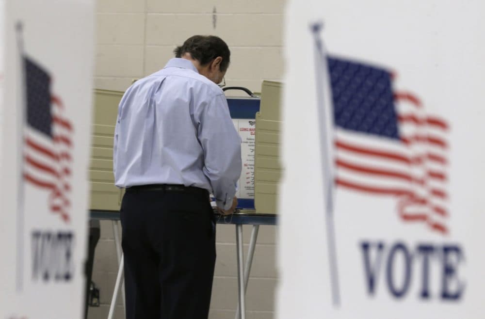 A voter casts his ballot at Orange High School in Moreland Hills, Ohio on Tuesday, Nov. 3, 2015. (Tony Dejak/AP)