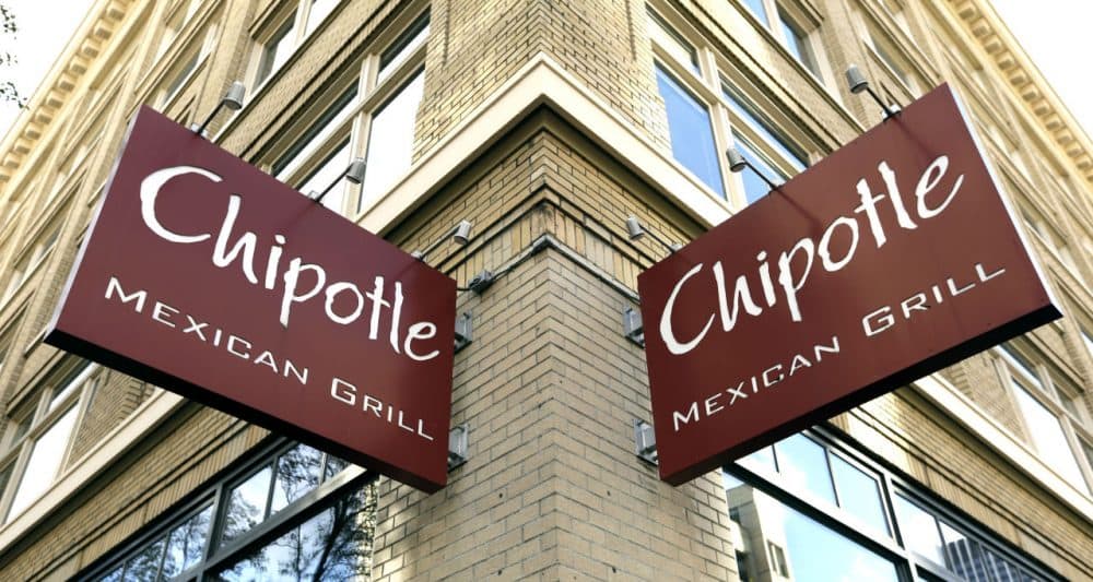Signage hangs from a closed Chipotle restaurant in Portland, Ore., Monday, Nov. 2, 2015. Chipotle voluntarily closed down 43 of its locations in Washington and the Portland area as a precaution after an E. coli outbreak linked to six of its restaurants in the two states has sickened 37 people. (Don Ryan/AP Photo)