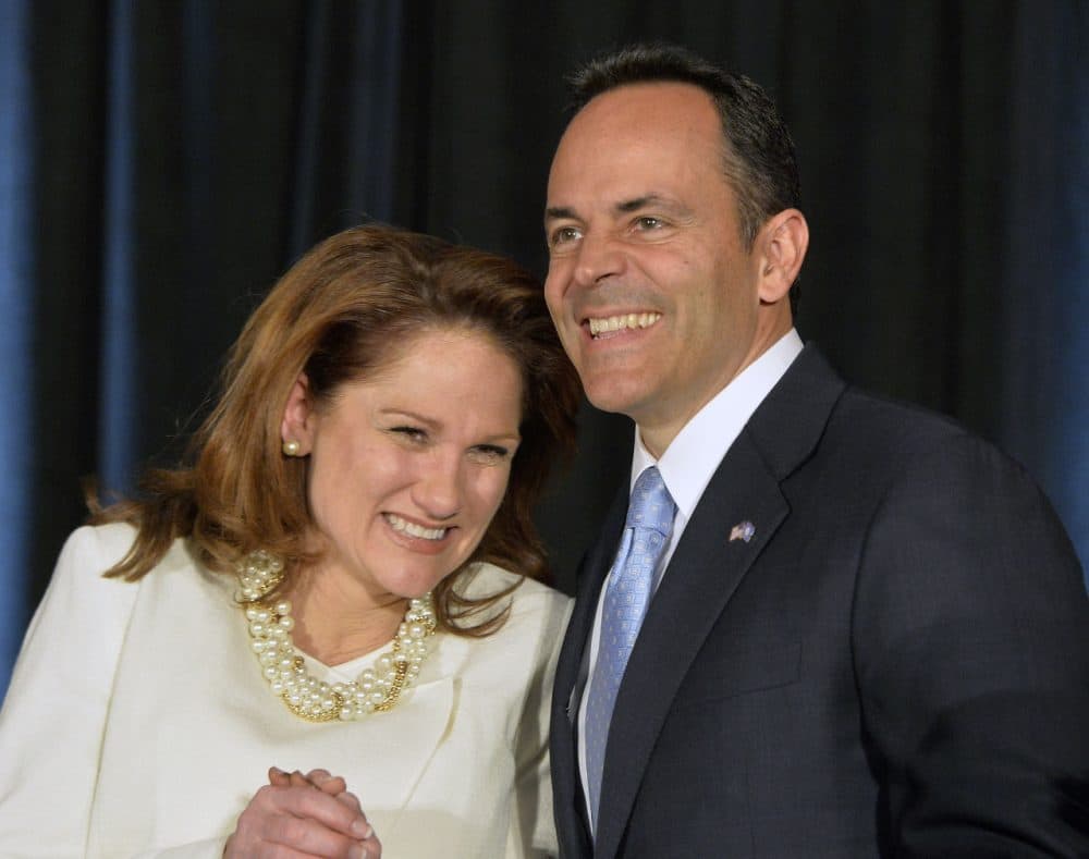 Kentucky Republican Governor-elect Matt Bevin, right, and his wife Glenna react to the cheers of supporters during his introduction at the Republican Party victory celebration, Tuesday, Nov. 3, 2015, in Louisville, Ky. (Timothy D. Easley/AP Photo)