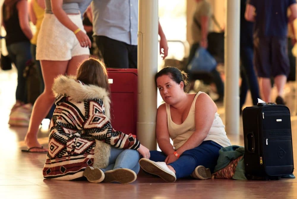 British tourists rest at the airport in Egypt's Red Sea resort of Sharm El-Sheikh on November 6, 2015. Britain moved to repatriate thousands of tourists from Egypt's Sharm el-Sheikh after warnings a 'terrorist bomb' may have brought down a Russian jet that took off from the resort, as several nervous airlines scrapped their flights. (Mohamed el-Shahed/AFP/Getty Images)