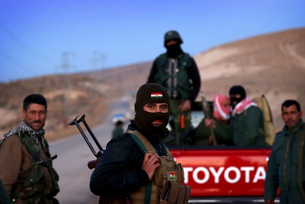 Iraqi Kurdish forces take part in an operation backed by U.S.-led strikes in the northern Iraqi town of Sinjar on November 12, 2015, to retake the town from the Islamic State group and cut a key supply line to Syria. The autonomous Kurdish region's security council said up to 7,500 Kurdish fighters would take part in the operation, which aims to retake Sinjar 'and establish a significant buffer zone to protect the (town) and its inhabitants from incoming artillery.' (Safin Hamed/AFP/Getty Images)