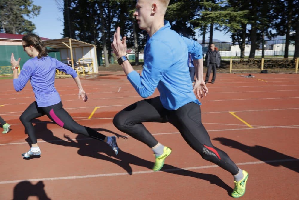 Athletes and their coaches attend a training session at the ‘Yunost‘ sports ground at the Black Sea resort of Sochi, Russia, Thursday, Nov. 12, 2015. Facing allegations that Russia engages in extensive, state-sponsored doping, President Vladimir Putin on Wednesday called on sports officials to carry out an internal investigation - but said that clean athletes shouldn't be punished for the actions of those who take banned drugs. (Dmitry Lovetsky/AP)