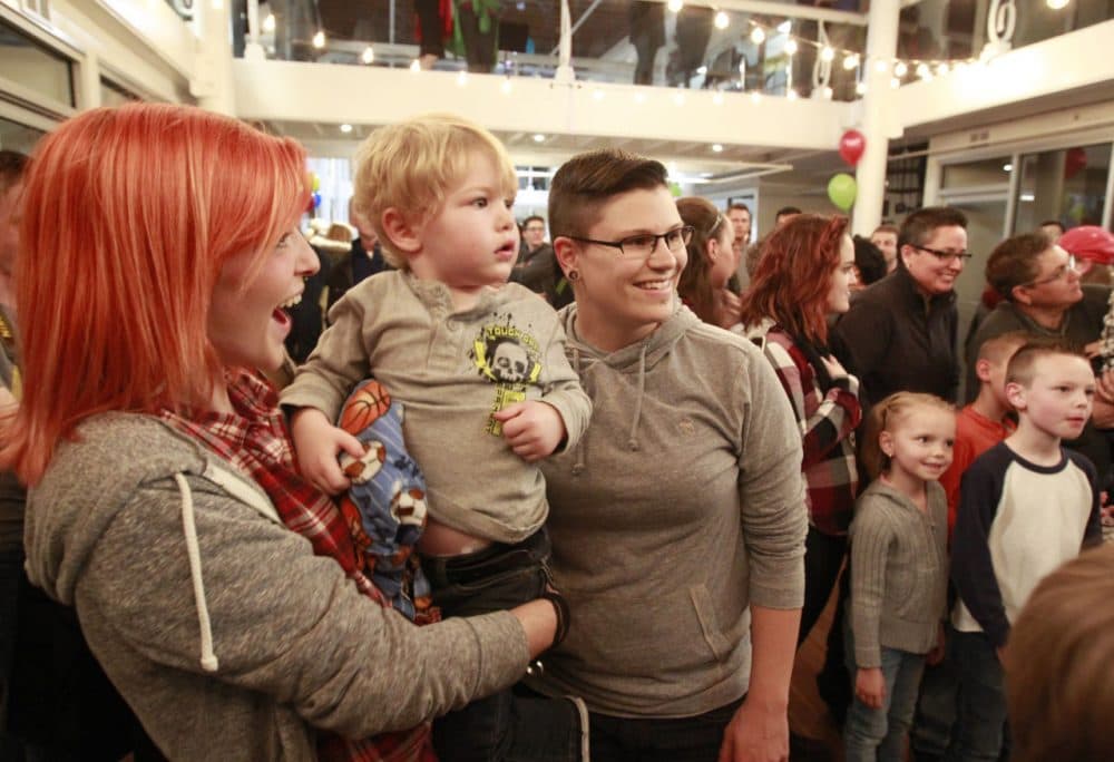 Families dance to a band at a rally and party in support of gay and lesbian families sponsored by the Utah Pride Center on November 9, 2015 in Salt Lake City, Utah. Last week the Mormon Church announced changes to their policies to classify people who enter into gay and lesbian marriages as apostates and ban their children from being blessed and baptized into the Mormon Church. (George Frey/Getty Images)