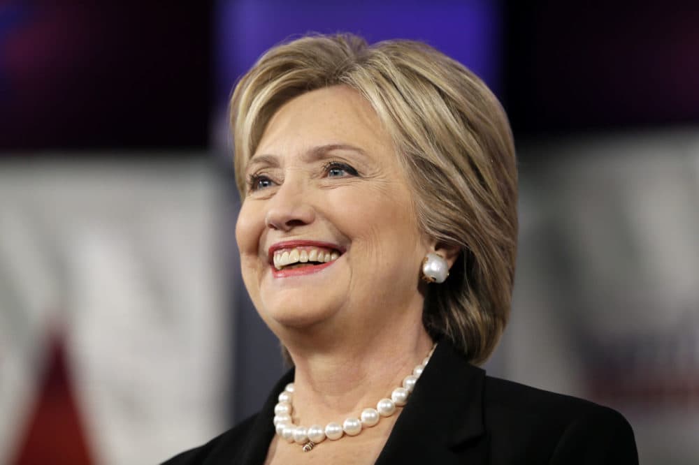Hillary Rodham Clinton smiles as she takes the stage during a Democratic presidential primary debate on Saturday in Des Moines, Iowa. (Charlie Neibergall/AP)