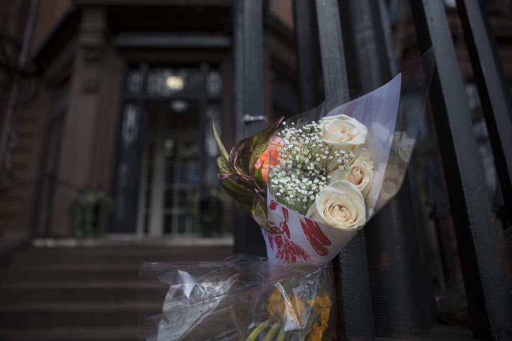 A bouquet of flowers was seen at the doorstep of the French Cultural Center on Marlborough Street in Boston Monday, in honor of the victims of the terrorist attacks in Paris. (Jesse Costa/WBUR)