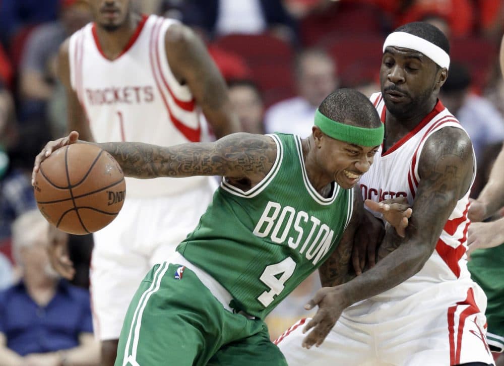 Boston Celtics' Isaiah Thomas (4) pushes against Houston Rockets' Ty Lawson during the game last night in Houston. (Pat Sullivan/AP)
