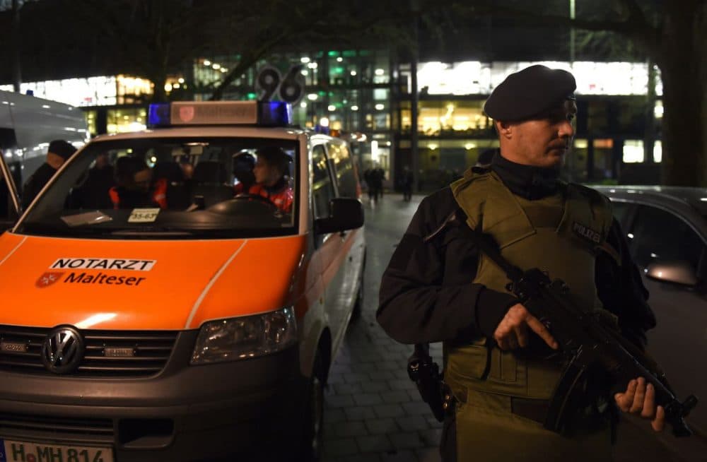 Police officers and rescuers stand at the entrance of the stadium as supporters leave the HDI Arena after the friendly football match Germany vs the Netherlands was called off for security reasons in Hannover on November 17, 2015. The football match was meant as a 'symbol of freedom' after the Paris attacks and was to be attended by Chancellor Angela Merkel. (Patrik Stollarz/AFP/Getty Images)