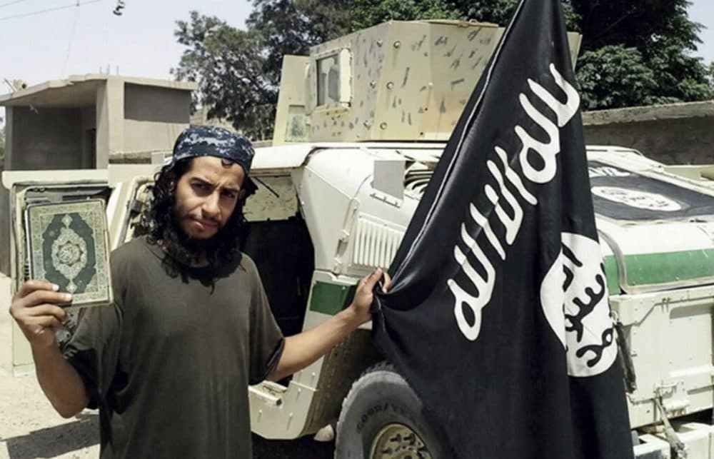 This undated image made available in the Islamic State's English-language magazine Dabiq, shows Belgian Abdelhamid Abaaoud. The Belgian jihadi suspected of masterminding deadly attacks in Paris was killed in a police raid on a suburban apartment building, the city prosecutor's office announced Thursday Nov. 1, 2015. Paris Prosecutor Francois Molins' office said 27-year-old Abdelhamid Abaaoud was identified based on skin samples. His body was found in the apartment building targeted in the chaotic and bloody raid in the Paris suburb of Saint-Denis on Wednesday. (Militant photo via AP)