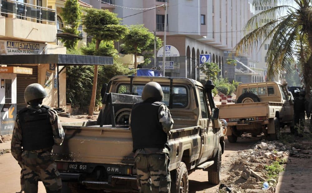 Malian troops take position outside the Radisson Blu hotel in Bamako on November 20, 2015. Gunmen went on a shooting rampage at the luxury hotel in Mali's capital Bamako, seizing 170 guests and staff in an ongoing hostage-taking that has left at least three people dead. (Habibou Kouyate/AFP/Getty Images)