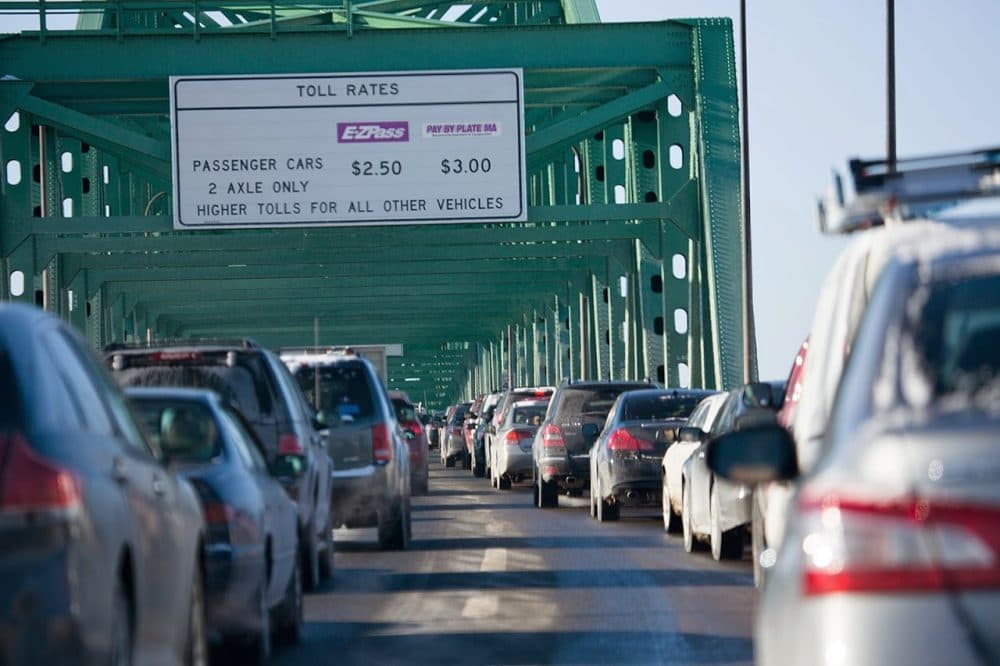 A new report is calling for improvements to Massachusetts public transportation systems to allow residents to cut down on driving miles, which the report says will save the state and its residents money. (Jesse Costa/WBUR)