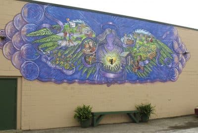 A mural covers the wall of a store in Rutland, Vt., commemorating the life of 17-year-old Carly Ferro, who was hit by a car and killed. Police said the driver was huffing from an aerosol can to intoxicate himself moments before the crash. Local officials said Ferro's 2012 death was the city's low point in its fight against heroin. (Wilson Ring/AP)