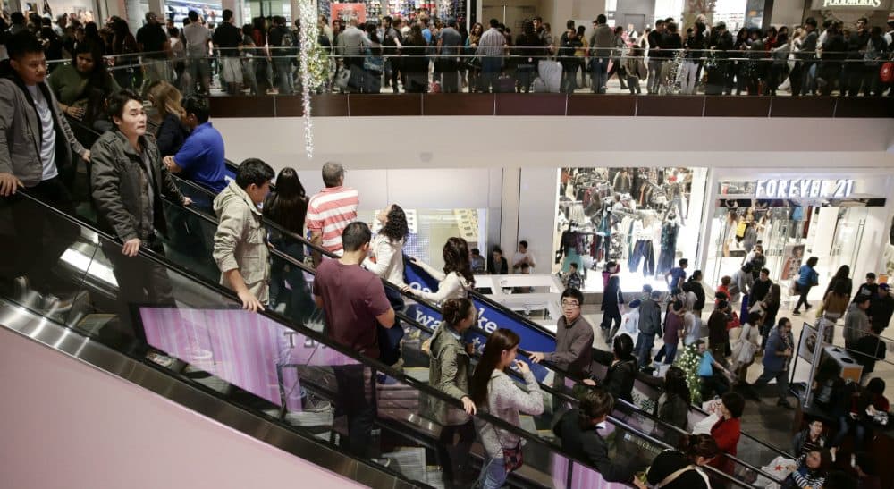 Mere hours after giving thanks, Black Friday beckons us to cast aside our gratitude in favor of a greedy lust for more, more, more. In this photo, shoppers throng Brea Mall during Black Friday shopping on Friday, Nov. 29, 2013, in Brea, Calif. (Jae C. Hong/ AP)
