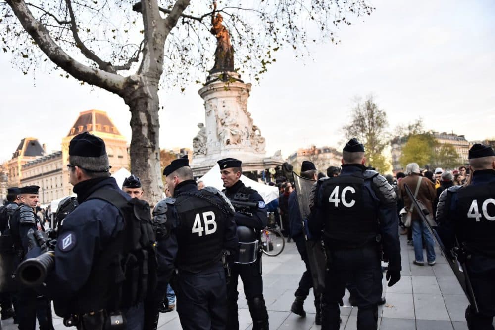 French gendarmes stand guard as dozens of people begin to gather for a demonstration in support of migrants at Place de la Republique (Republic Square) in Paris amid a ban on public gatherings on November 22, 2015. Paris has extended a ban on public gatherings introduced after the terror attacks in the French capital until November 30, the start of UN climate talks, the city's police headquarters said on November 21. (Loic Venance/AFP/Getty Images)