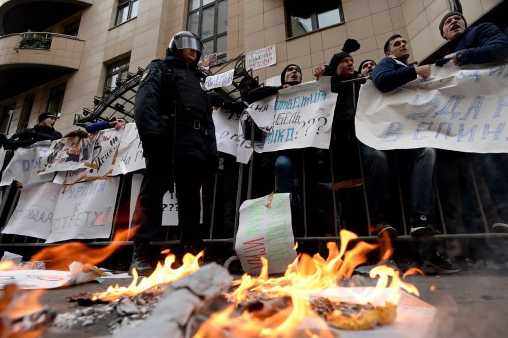 Protesters hold placards and shout slogans as they take part in an anti-Turkey picket outside the Turkish embassy in Moscow on November 25, 2015. Turkey shot down a Russian war plane on the Syrian border on November 24, sending tensions spiraling as Russian President Vladimir Putin warned Ankara its &quot;stab in the back&quot; would have serious consequences. (Kirill Kudryavtsev/AFP/Getty Images)