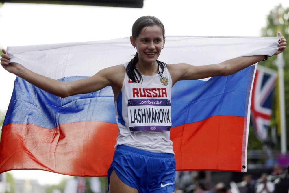 In this Saturday, Aug. 11, 2012 file photo, Russia's Elena Lashmanova celebrates after winning the gold medal in the women's 20-kilometer race walk at the 2012 Summer Olympics, in London. Two Russian Olympic medal hopefuls, including reigning womens race-walking champion Elena Lashmanova, could miss next years Olympics as the IAAF investigates whether they competed while banned for doping. The new probe comes at a time when the IAAF and World Anti-Doping Agency are already investigating allegations of systematic doping and cover-ups in Russia. (AP Photo/Mike Groll, File)