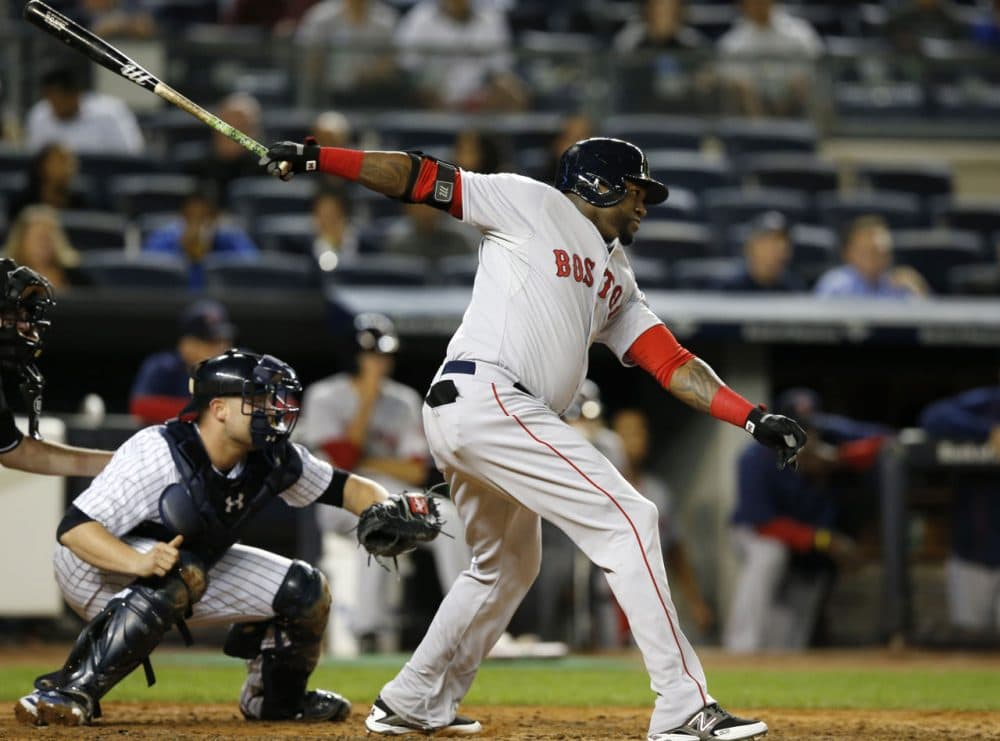 Boston Red Sox designated hitter David Ortiz hits a third-inning, RBI single in a baseball game against the New York Yankees in New York, Wednesday, Sept. 30, 2015.   (AP Photo/Kathy Willens)