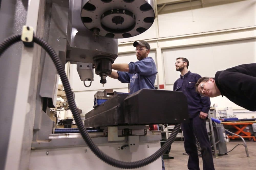 Classes like &quot;Advanced precision machining&quot; prepare students for mill jobs straight out of vocational school. (Carlos Osorio/AP)