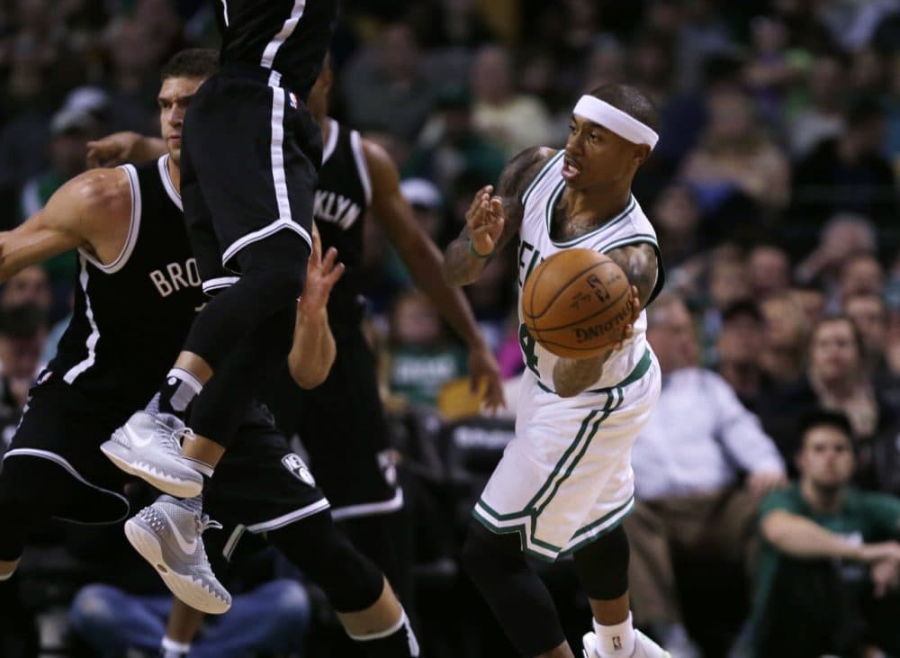 Boston Celtics guard Isaiah Thomas (4) passes  during Friday night's game in Boston. (Charles Krupa/AP)