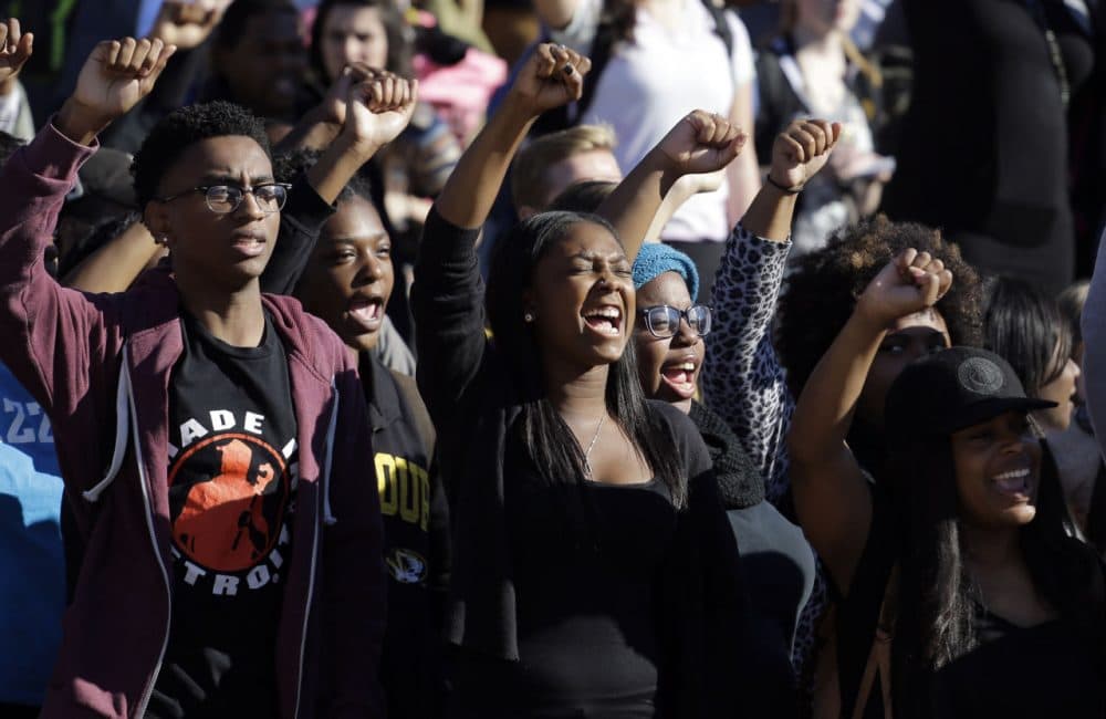 In this Nov. 9, 2015, photo, students cheer while listening to members of the black student protest group Concerned Student 1950 speak following the announcement that University of Missouri System President Tim Wolfe would resign at the university. (Jeff Roberson/ AP)