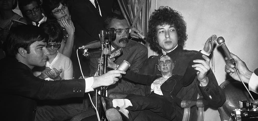 Bob Dylan faces the press in Paris in 1966. (Godot/AP)