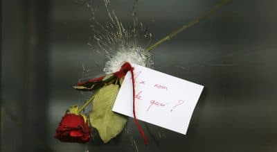 John Tirman: &quot;France was the epicenter of the Enlightenment that fairly defines Western civilization. And the jihadis, in their reckless, apocalyptic pathology, detest above all such values.&quot; Pictured: A message that reads: 'In the name of what?' and a rose is placed through a bullet hole in a window at the restaurant on Rue de Charonne, Paris, Sunday, Nov. 15, 2015, where attacks took place on Friday. (Frank Augstein/AP)