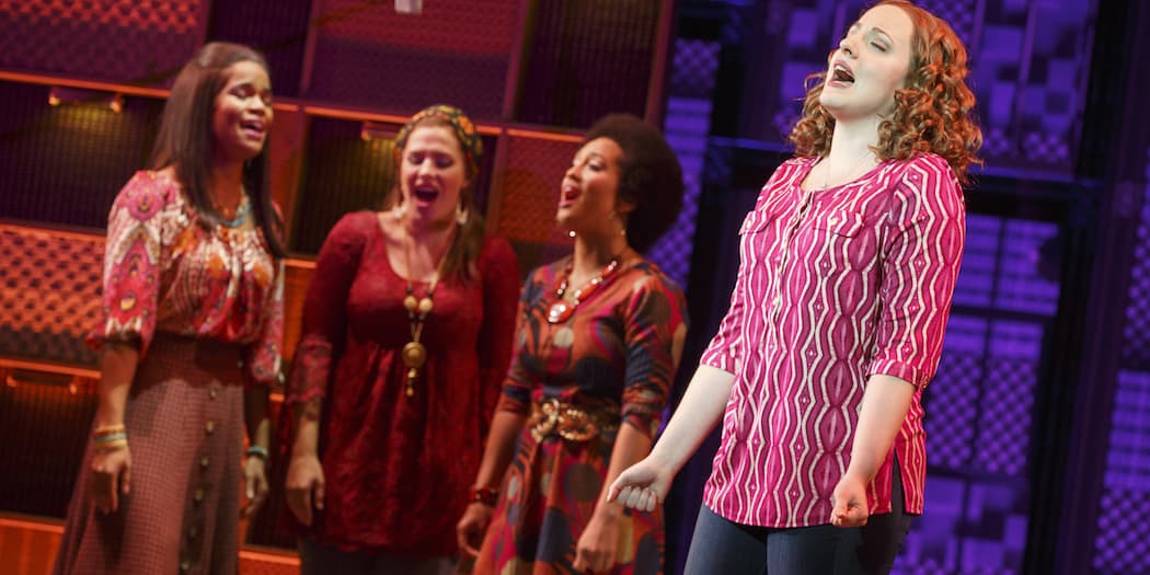 (L-R) Britney Coleman, Sarah Bockel, Ashley Blanchet and, in the foreground, Abby Mueller as Carole King. (Courtesy of Joan Marcus/Broadway in Boston)