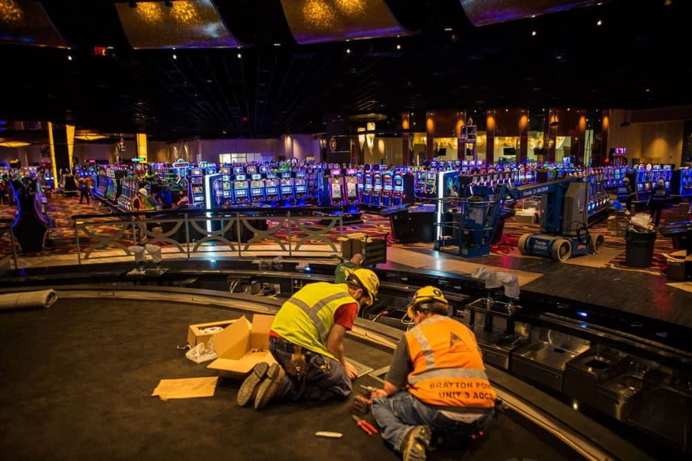 Workers finishing up Plainridge Park Casino in Plainville in June. (Jesse Costa/WBUR)