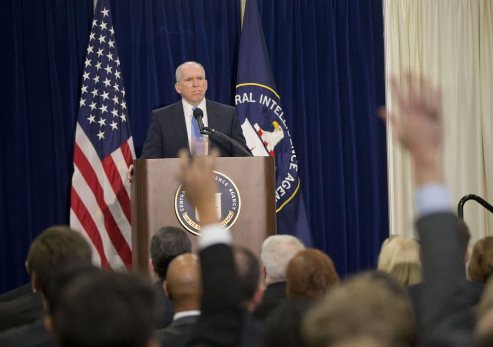 Members of the media raise their hands during CIA Director John Brennan's news conference at CIA headquarters in Langley, Va., Thursday, Dec. 11, 2014. Brennan was defending his agency from accusations in a Senate report that it used inhumane interrogation techniques against terrorist suspect with no security benefits to the nation. (Pablo Martinez Monsivais/AP Photo)