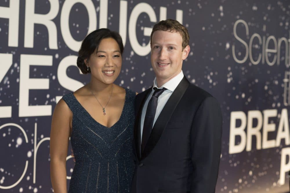 In this Nov. 9, 2014 file photo, Priscilla Chan and Mark Zuckerberg arrive at the 2nd Annual Breakthrough Prize Award Ceremony at the NASA Ames Research Center in Mountain View, Calif. Zuckerberg and Chan have announced they will be donating 99 percent of their Facebook shares - currently valued at more than $45 billion - to charitable purposes. (Peter Barreras/Invision/AP)