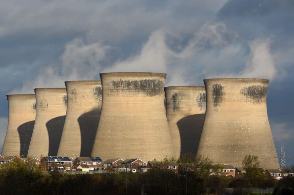 A general view shows a residential estate in front of the Ferrybridge C power station, near Knottingley in northern England, on November 10, 2015. The coal fired power station is owned by energy company SSE, and is expected to close by the end of March 2016. (Oli Scarff/AFP/Getty Images)