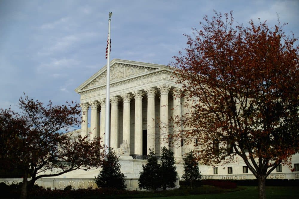 The United States Supreme Court building is framed by fall foliage November 6, 2015 in Washington, D.C. (Chip Somodevilla/Getty Images)