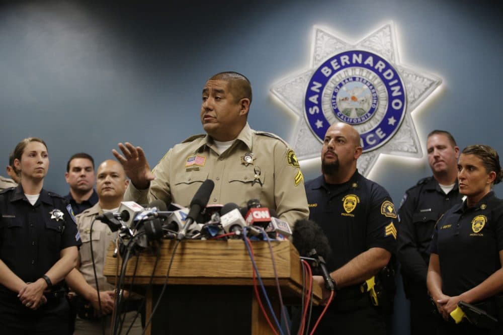 San Bernardino County Sheriff's detective Jorge Lozano, center, answers questions from reporters during a news conference with the first responders on the scene of last week's shooting, Tuesday, Dec. 8, 2015, in San Bernardino, Calif. Lozano was captured on video in a hallway of the Inland Regional Center telling employees and others who were stranded to follow him and that he would &quot;take a bullet before you do.&quot; (Jae C. Hong/AP)