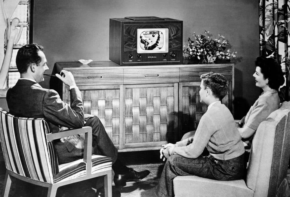 In this 1948 photo, an American family watches a tabletop radio television. (AP)